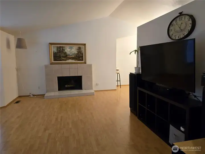 Pretty Wood Fireplace.  Dining room to the right.