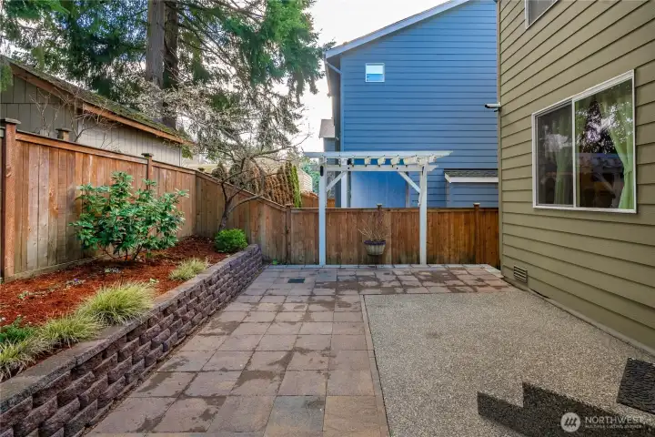 Low maintenance back patio with easy care landscaping