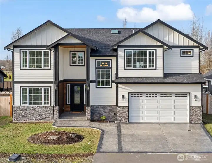 Welcome to this 2024 built, custom home in Buckley