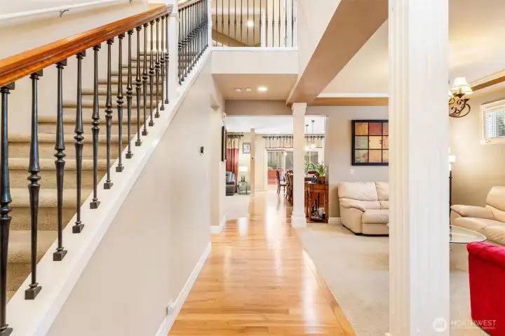 A grand entry with millwork that makes a statement, hardwood floors that shine from the front and to the back of the house.