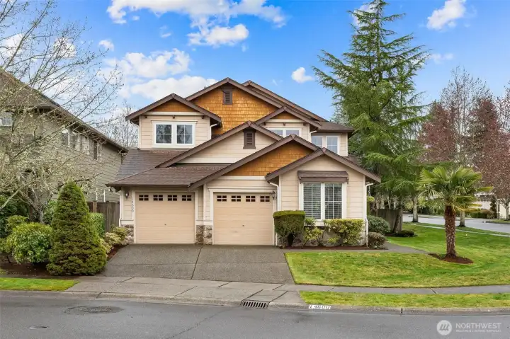 Hardy board siding, wood shake accents, a new 30 year composition roof est. install date of 4/22/2026 with transferrable warranty for the buyer, and a 3 car tandem garage.