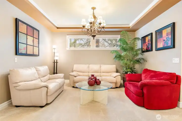 This conversation corner features a classic tray ceiling with chandelier, but this room could also accommodate a formal dining table with hutch and side table.