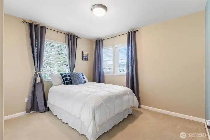 Corner window bedroom with a generous closet. Queen sized bed.