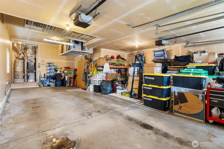 Newer furnace, two overhead storage racks, tandem parking for 3 cars, and two garage motors.