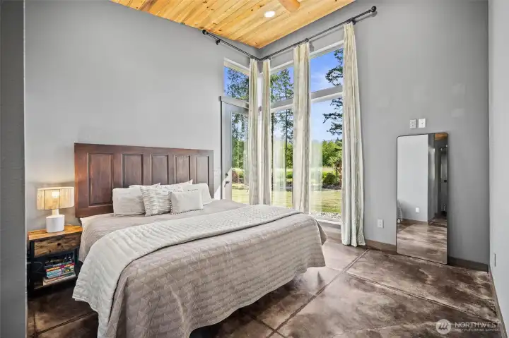 Your private primary retreat where the door exits right to the hot tub.
