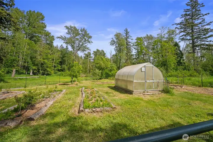 Garden beds and greenhouse.
