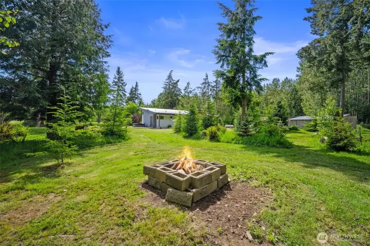 Private firepit space tucked a bit back from the main house.