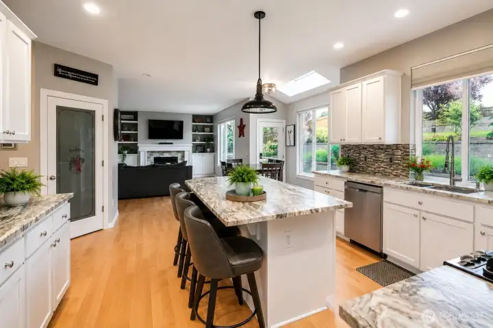 Walk in Pantry, large center eating island open to the family room. (extra greenery-virtual) Walk in Pantry, large center eating island open to the family room. (extra greenery-virtual)