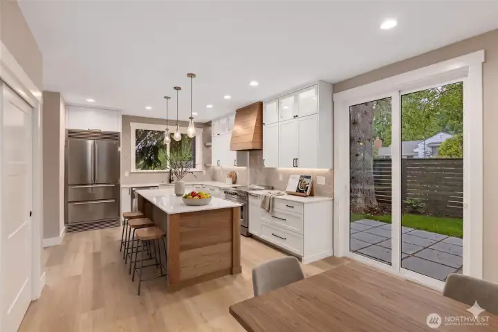 Kitchen open to dining area (virtually staged) Kitchen open to dining area (virtually staged)