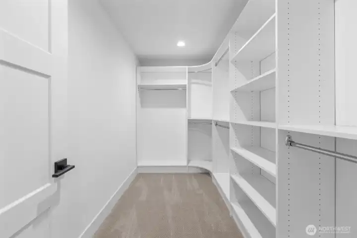 Primary walk-in closet Primary walk-in closet