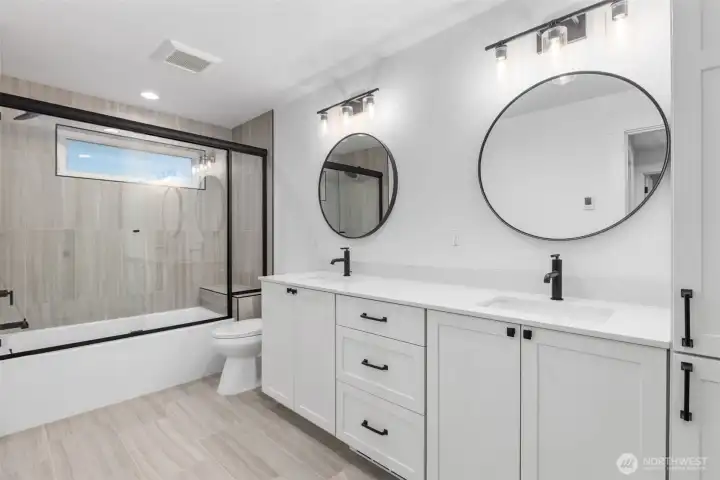 Full bath with dual vanity and linen closet Full bath with dual vanity and linen closet