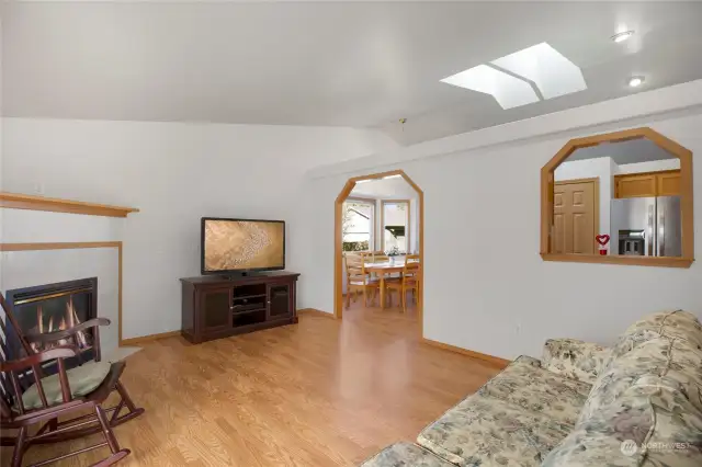 Here is another view of the family room, this time looking back at the kitchen. Notice the skylights which really provide tons of natural light. Other owners of this floorplan in the neighborhood have removed the wall between the family room and the kitchen opening things up even more!