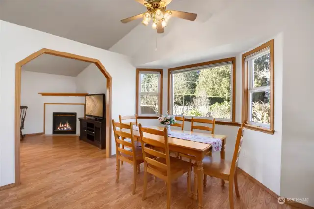 The dining area can handle a large table and has a beautiful view of the private yard.