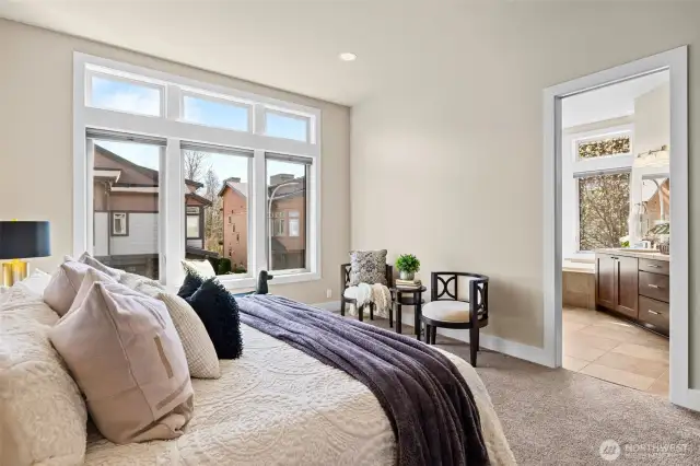 The Primary Bedroom leads into the private en-suite and a walk-in closet.