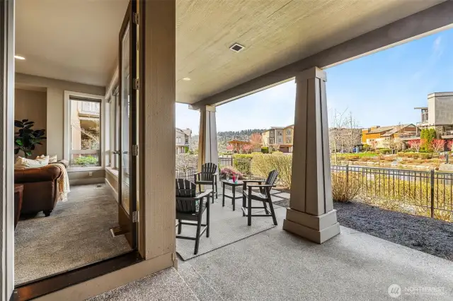 The Back Patio is covered with views of the lake and pond! Fully Fenced Back Yard.
