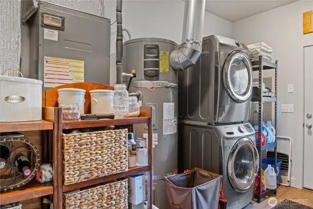 Nice size laundry room with XL hot water tank.