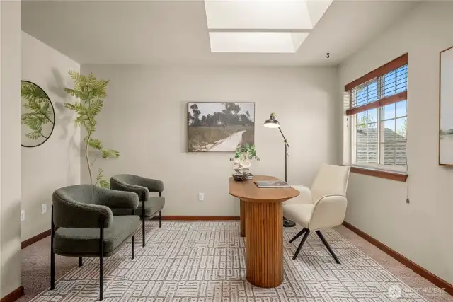 French doors open to this bedroom with skylights at the top of the stairs. This space would also be perfect for an office, studio or playroom.
