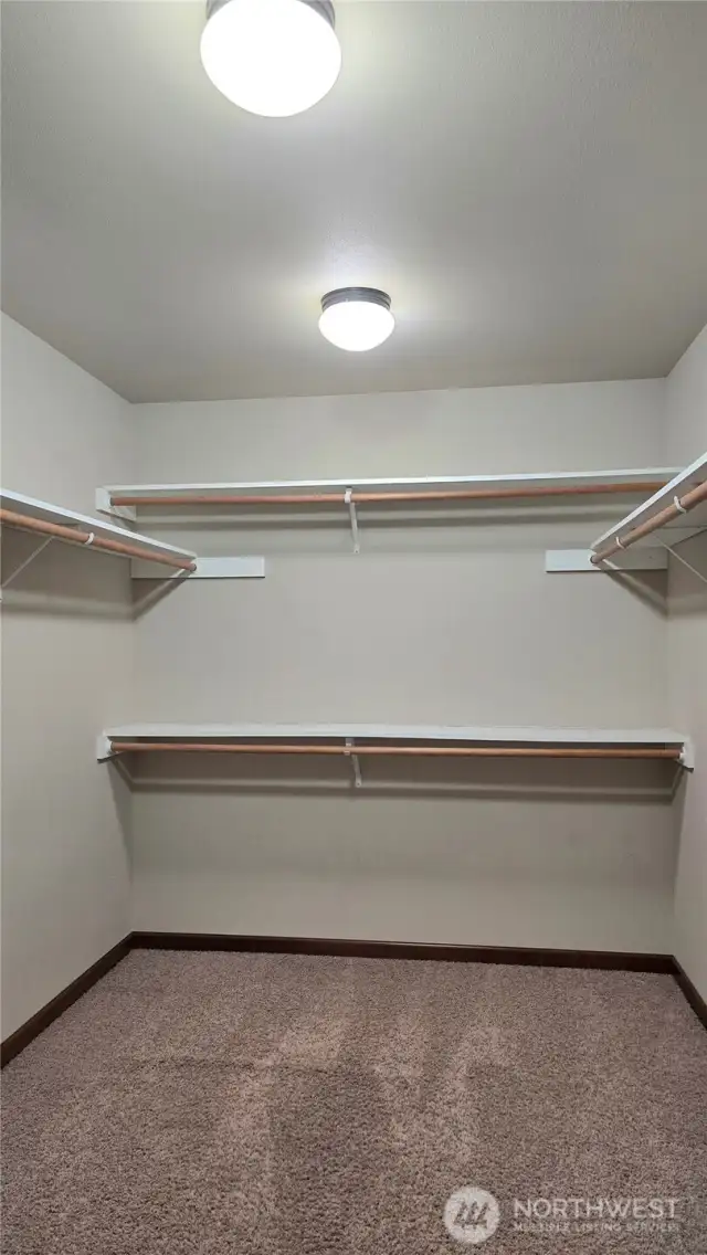 The large primary walk-in-closet offers ample space for your storage needs.