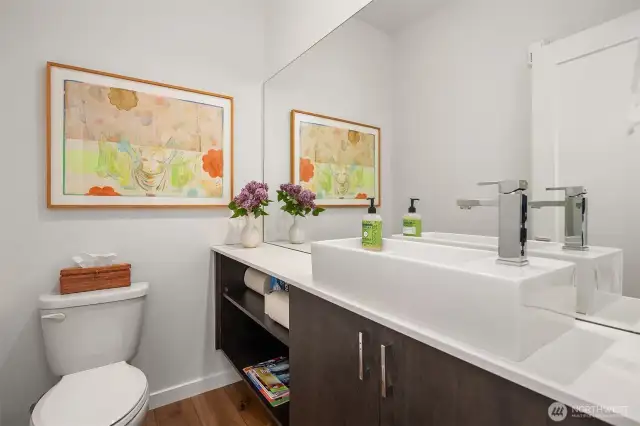 Half bath on the Second floor.  Convenient for guests as it is just off the living and dining entertaining spaces.  There is a bathroom on every floor in the townhouse.