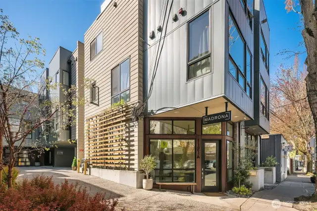 Farther back from the close-up on front door, is this picture of the Commercial space and the second floor living space. Sustainable development, high performance materials, quality of life are hallmarks of Built Green homes.