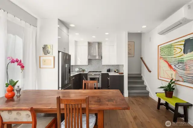 From the living room this photo looks at the kitchen. The open floor plan allows the cook to visit with guests.