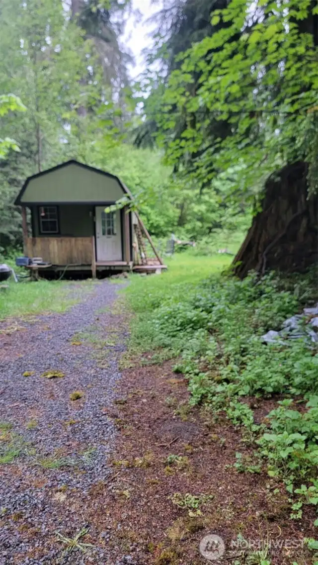 Cabin w/shower inside.   Outhouse outside