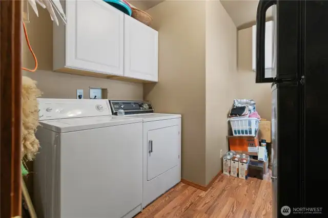 Spacious utility room located on the main floor for convenient access.