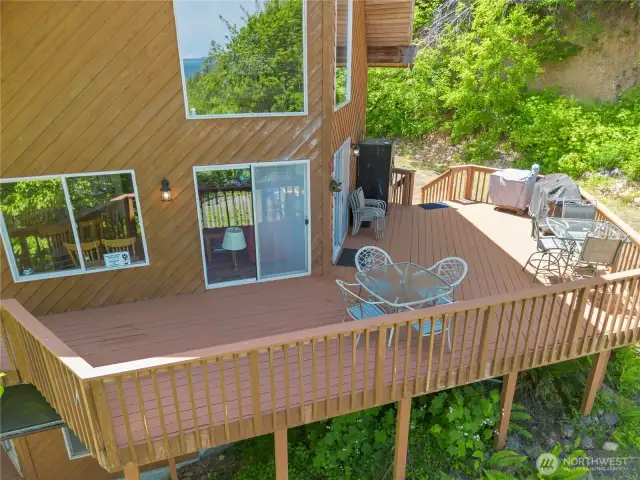 The large deck offers spacious outdoor living with room for seating, dining, or entertaining.