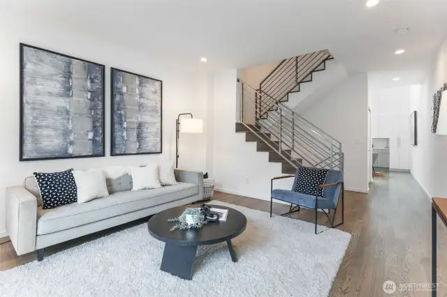 Come up from ground- level to the bright, main living area.