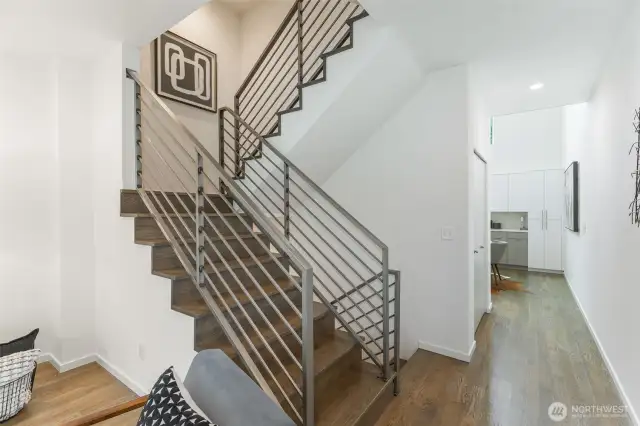 Looking towards the light-filled kitchen- notice large pantry/storage closet on the left past the stairs.