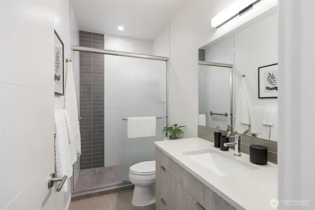 Just a couple steps from Primary bedroom is the 3/4 newer bath (tub was converted to walk-in shower last year).