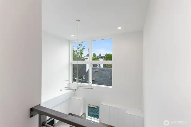 Openness on this level lets the beautiful light in from kitchen windows!
