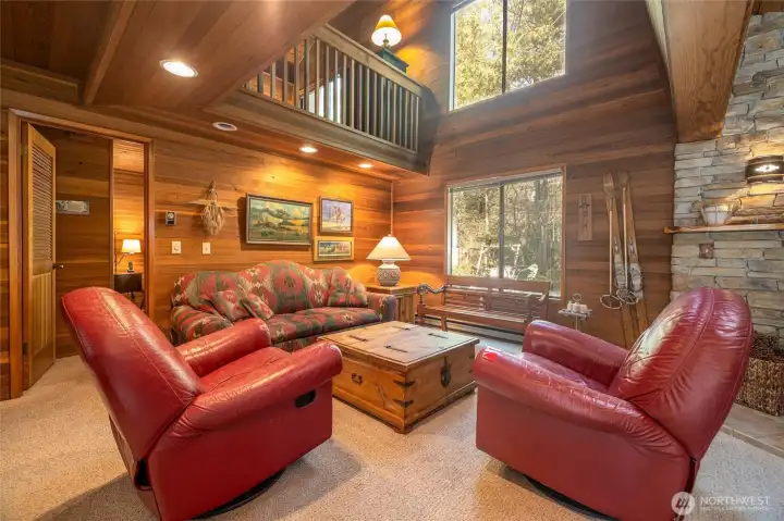 Enter into the great room with tall ceilings and large windows
