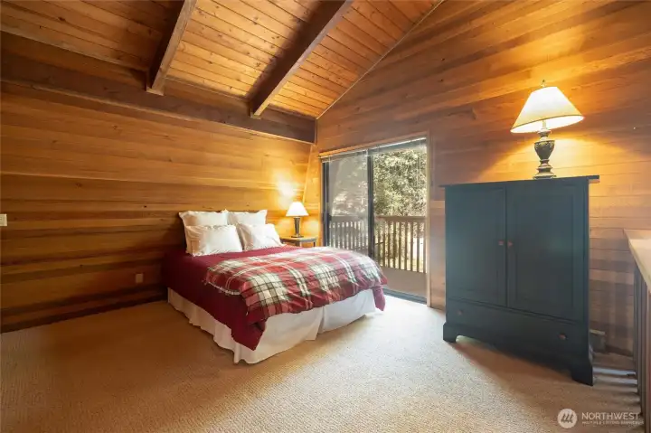 Upstairs is the huge loft/bonus area with vaulted ceilings and access to the upper deck