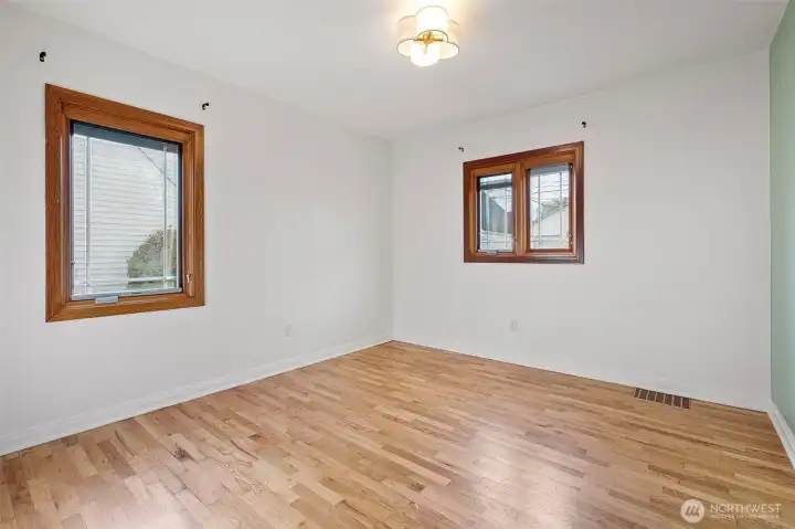 Main-level bedrooms with original hardwood