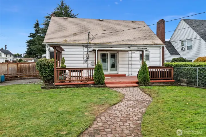 Spacious yard perfect for recreation, gardening and gathering.