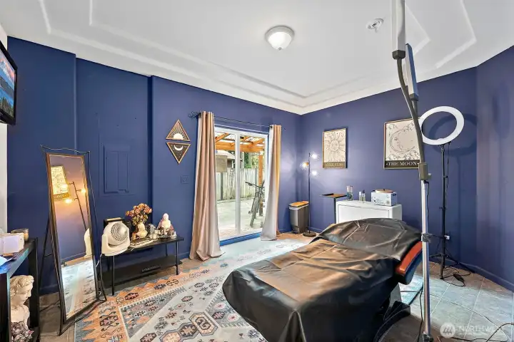 Studio space, slider leads out to patio, currently used as a cosmetology business. What would this be for you?