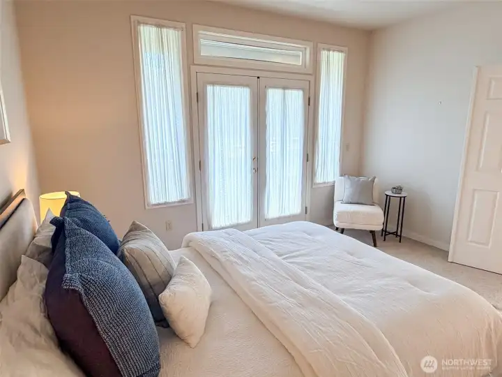 Primary bedroom opens onto the deck