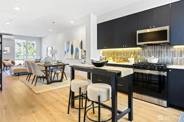 This open-concept layout keeps everyone connected — from kitchen prep to dinner to movie nights in the living room.