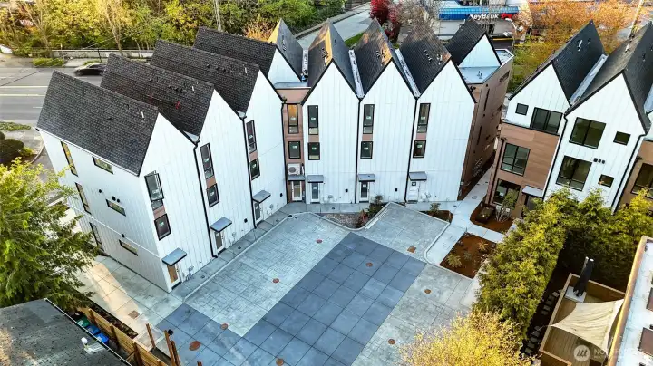 An exclusive community courtyard designed for connection, safety, and ease — with clean concrete paths and no through traffic.