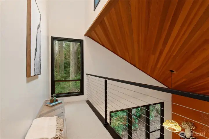 loft at top of stairwell runs the width of the home