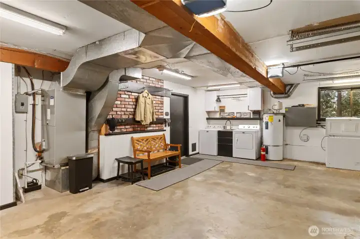 Attached garage space with laundry and storage room.