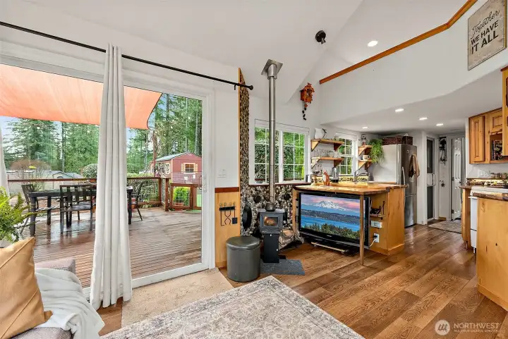 Living room with vaulted ceilings and natural light creates a comfortable, open atmosphere.