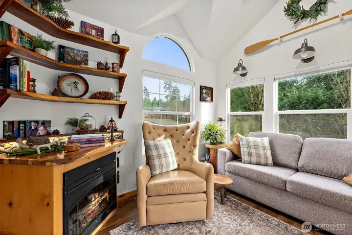 Abundant natural light and vaulted ceilings enhance the open, comfortable feel of the living area.
