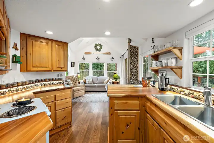Kitchen flows seamlessly into the living area, maximizing space and functionality.