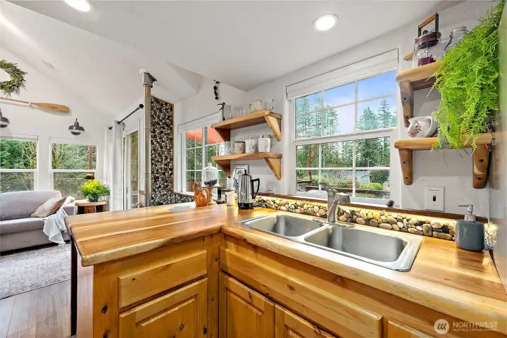 Custom wood countertops bring warmth and craftsmanship to this thoughtfully designed kitchen.