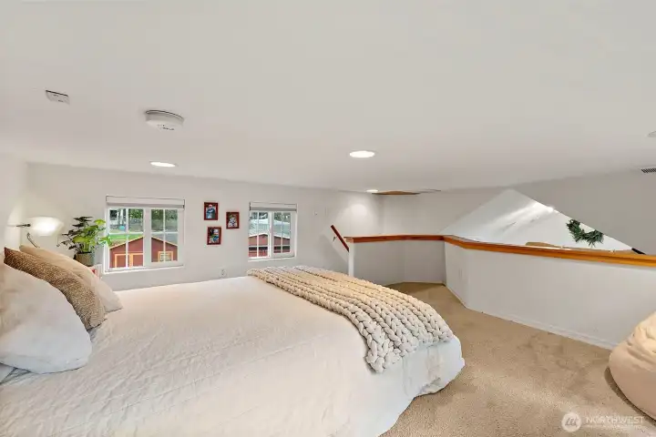 Upstairs loft with comfortable layout and abundant natural light.