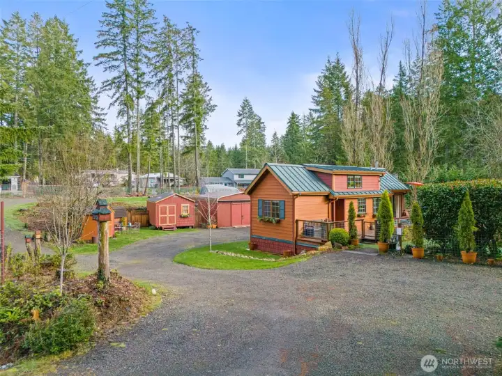 Thoughtfully arranged home and outbuildings set within a peaceful, landscaped environment.