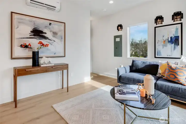 All levels have efficient mini-splits for year-round comfort. Around the corner,  stairs lead to the private top floor primary suite.