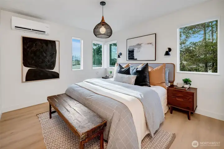 Primary top-floor ensuite with large tiled shower, a spacious walk-in closet, custom lighting, and restful design.